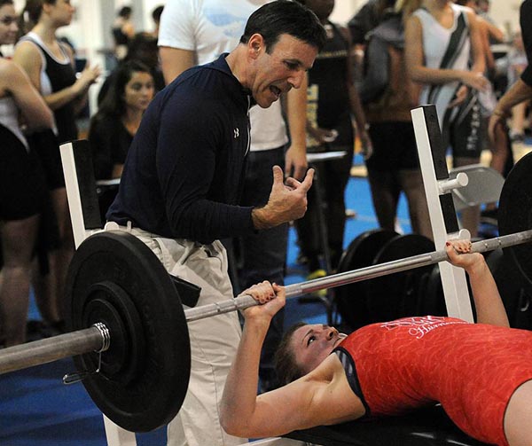 Manatee High Coach Richard Lansky urges Madison Johnston to keep pressing on her 120 lb bench press attempt at the district girls weightlifting meet at Manatee Wednesday. Read more here: http://www.bradenton.com/latest-news/article54624595.html#storylink=cpy