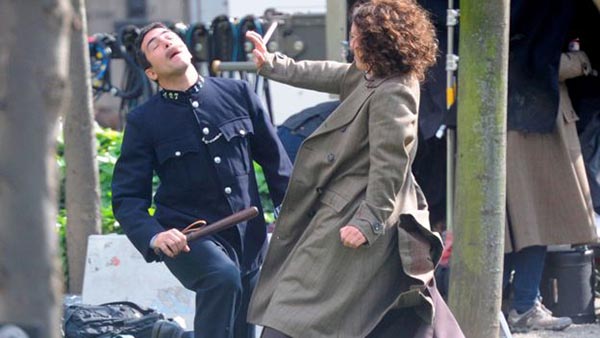 Filming on the Suffragette set: A protester defends herself against a policeman's truncheon