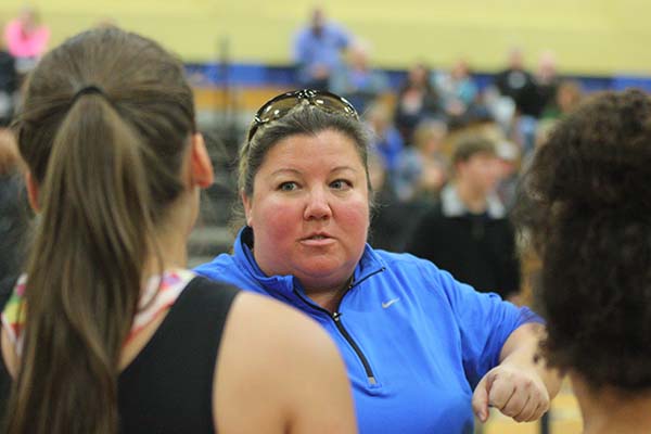 Coach Sara Novak teaches her players technique in between lifts.