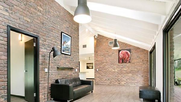 Kortney Olson and David May's Worongary home features exposed brick.
